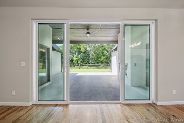 682 W 113th Ct S, Jenks, OK 74037 - doorway featuring wood finished floors and baseboards