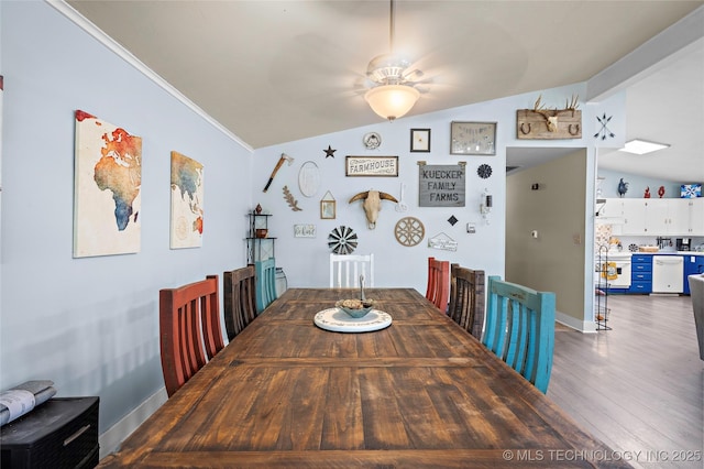 532 Hammers Rd, Ardmore, OK 73401 - dining area featuring vaulted ceiling, baseboards, wood finished floors, ornamental molding, and ceiling fan