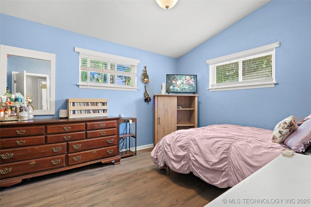 532 Hammers Rd, Ardmore, OK 73401 - bedroom with vaulted ceiling, wood finished floors, and baseboards