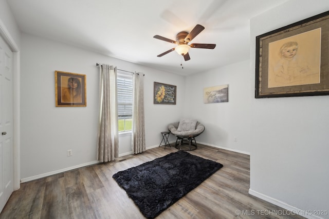 27108 E 82nd St S, Broken Arrow, OK 74014 - living area with a ceiling fan, wood finished floors, and baseboards
