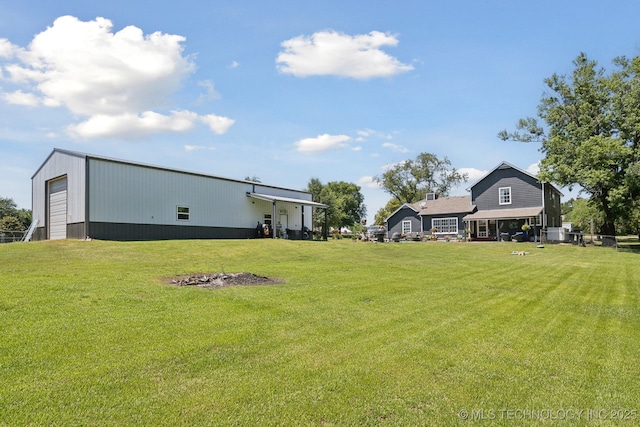 27108 E 82nd St S, Broken Arrow, OK 74014 - view of green lawn with an outbuilding and a detached garage