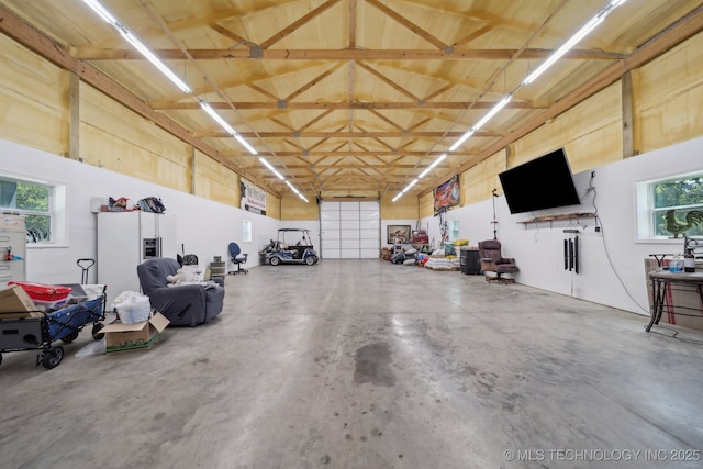 27108 E 82nd St S, Broken Arrow, OK 74014 - garage with white refrigerator with ice dispenser