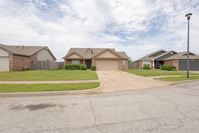 14507 E 110th Pl, Owasso, OK 74055 - view of front of home with brick siding, concrete driveway, and an attached garage