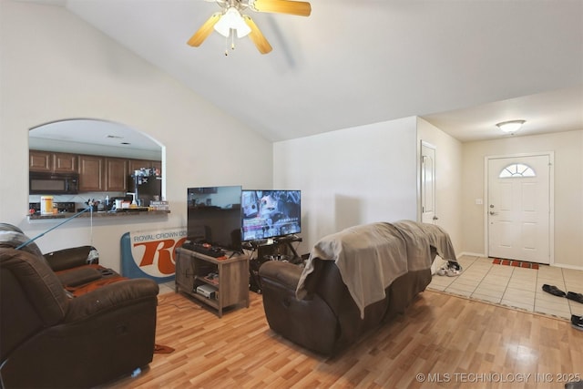 14507 E 110th Pl, Owasso, OK 74055 - living room with light wood-style floors, vaulted ceiling, and ceiling fan