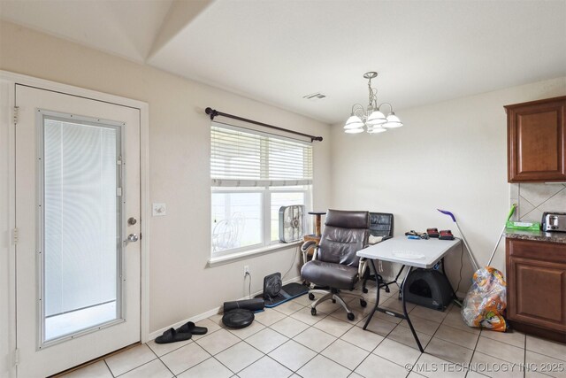 14507 E 110th Pl, Owasso, OK 74055 - living area with a chandelier, baseboards, and light tile patterned flooring
