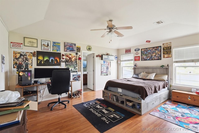 14507 E 110th Pl, Owasso, OK 74055 - bedroom featuring wood finished floors, a desk, and ceiling fan