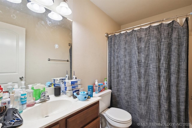 14507 E 110th Pl, Owasso, OK 74055 - bathroom featuring toilet, vanity, and curtained shower