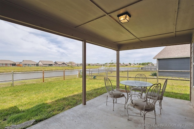 14507 E 110th Pl, Owasso, OK 74055 - view of patio featuring a water view, outdoor dining space, and a residential view