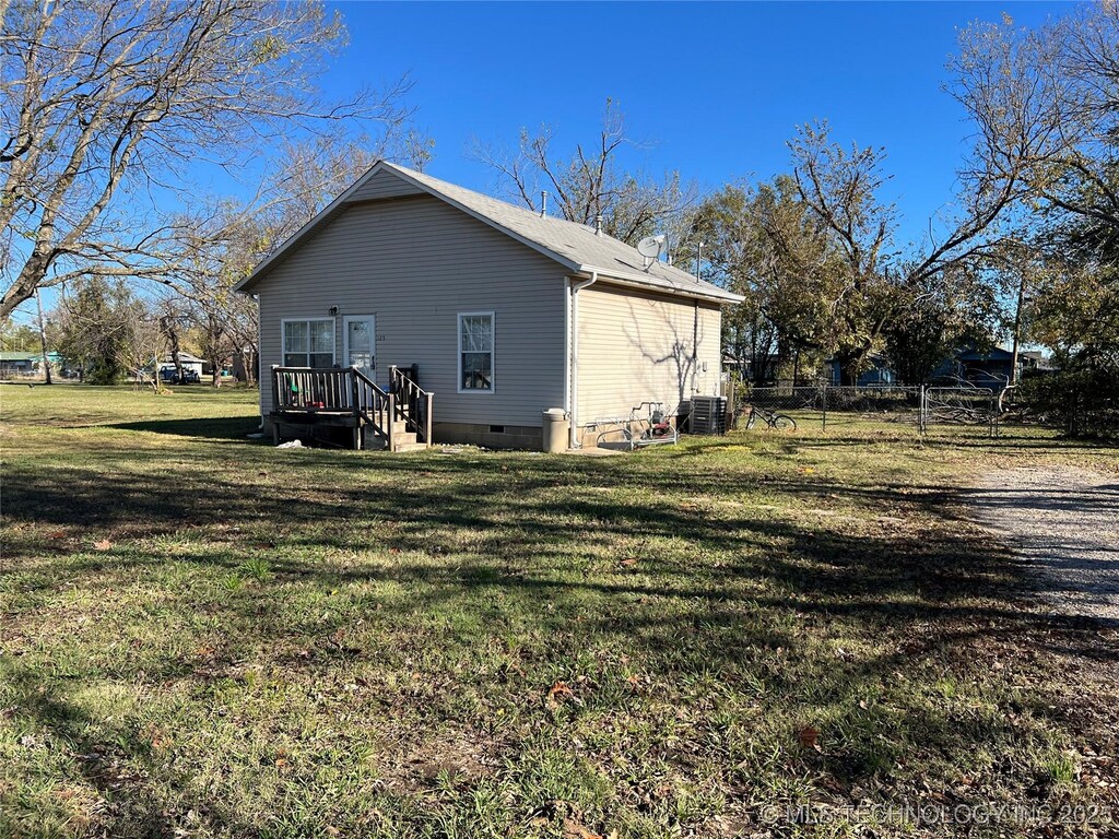 125 C St SE, Inola, OK 74036 - view of side of property featuring crawl space and central AC