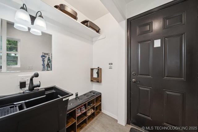 239 Seneca Dr, Sand Springs, OK 74063 - bathroom with baseboards and wood finished floors