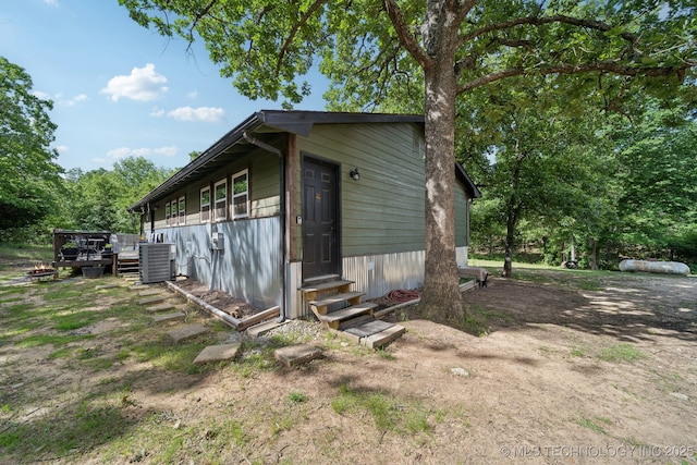 239 Seneca Dr, Sand Springs, OK 74063 - view of home's exterior featuring entry steps, cooling unit, and a deck