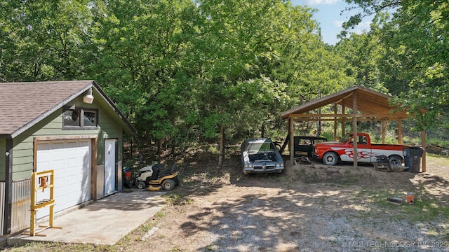 239 Seneca Dr, Sand Springs, OK 74063 - view of yard with an outdoor structure and a detached garage
