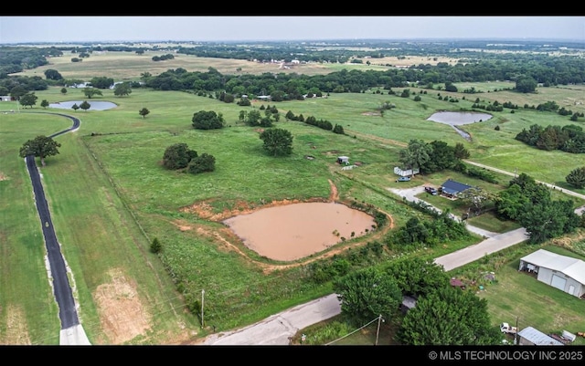 681 Cimmaron, Wilson, OK 73463 - aerial view of property and surrounding area featuring rural landscape and a nearby body of water