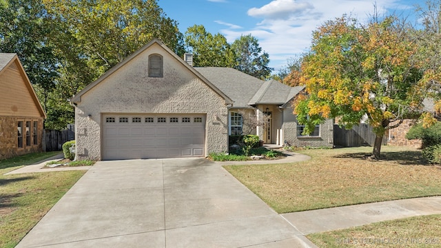 8008 S Juniper Ave, Broken Arrow, OK 74011 - view of front of house featuring an attached garage, driveway, and a chimney