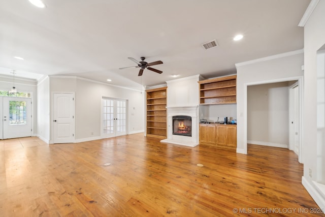 8008 S Juniper Ave, Broken Arrow, OK 74011 - unfurnished living room featuring recessed lighting, ornamental molding, baseboards, a lit fireplace, and a ceiling fan