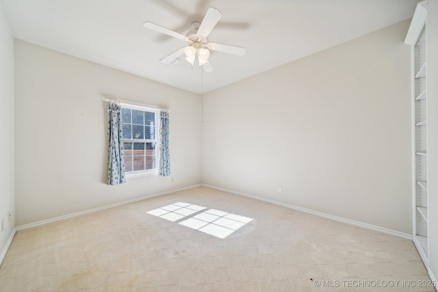 8008 S Juniper Ave, Broken Arrow, OK 74011 - unfurnished bedroom with light colored carpet, baseboards, and ceiling fan