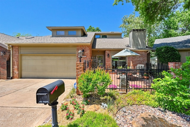 3805 E 64th Pl, Tulsa, OK 74136 - view of front of house featuring brick siding, fence, a garage, and driveway
