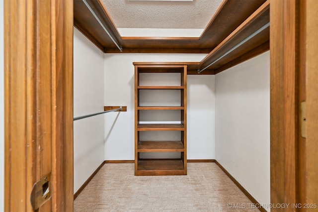 3805 E 64th Pl, Tulsa, OK 74136 - walk in closet with carpet flooring