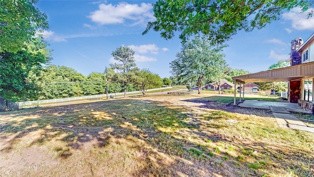 view of yard with fence and a patio area