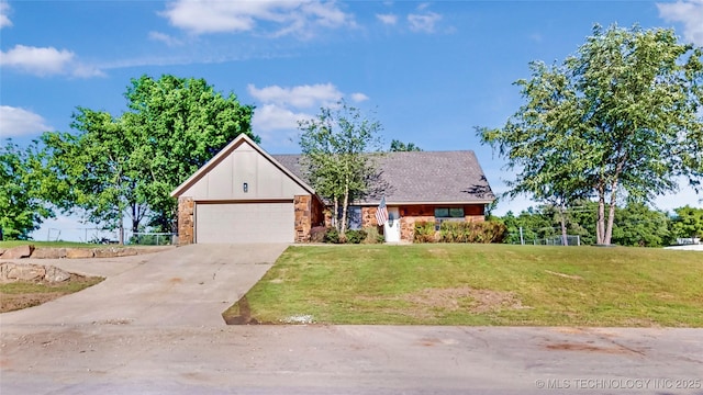 view of front of house featuring a front lawn, a garage, stone siding, driveway, and board and batten siding
