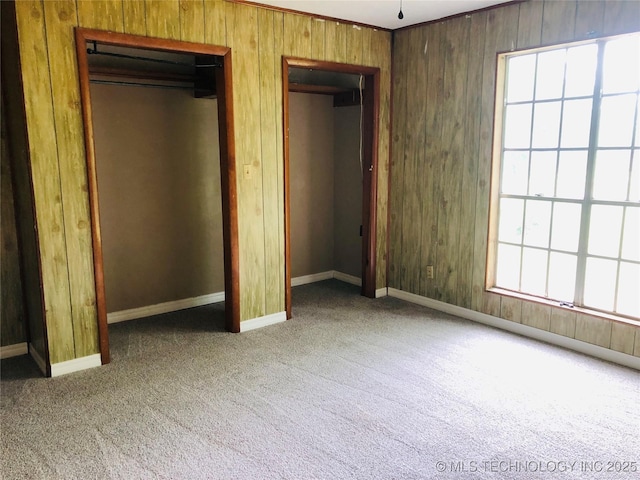 509 N Michigan Ave, Cushing, OK 74023 - unfurnished bedroom featuring carpet flooring and two closets