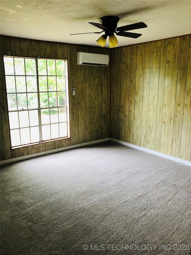 509 N Michigan Ave, Cushing, OK 74023 - unfurnished room featuring a wall mounted air conditioner, carpet flooring, ceiling fan, and wood walls