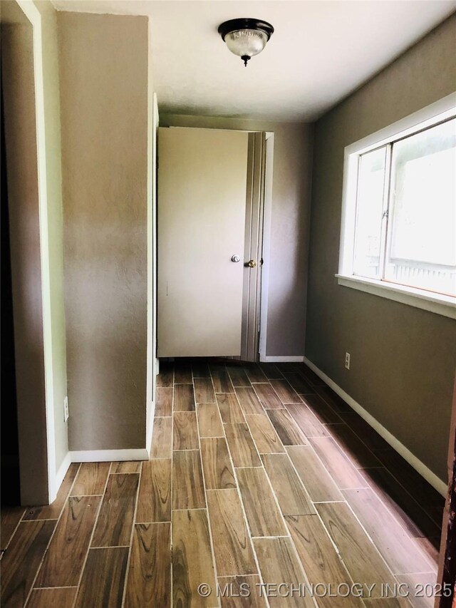 509 N Michigan Ave, Cushing, OK 74023 - spare room with wood finish floors and baseboards