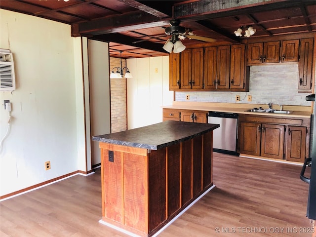 509 N Michigan Ave, Cushing, OK 74023 - kitchen featuring stainless steel dishwasher, a sink, wood finished floors, a ceiling fan, and wood ceiling with exposed beams