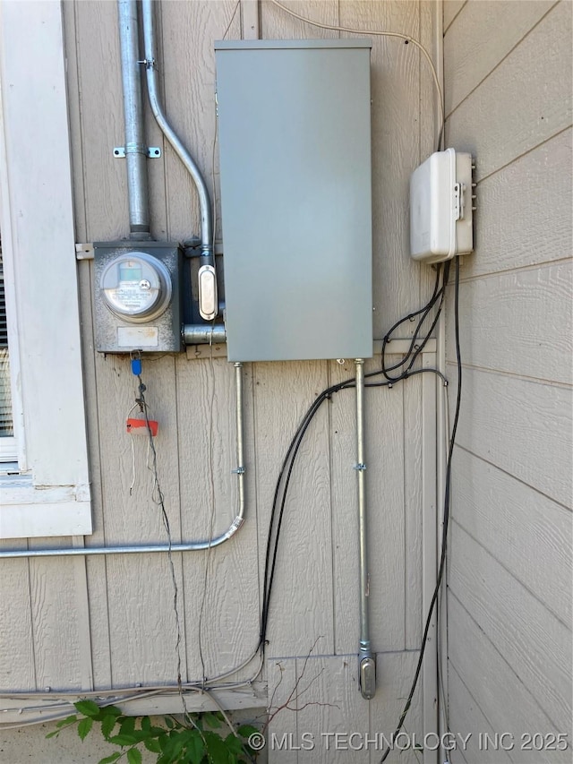 509 N Michigan Ave, Cushing, OK 74023 - utility room featuring electric meter