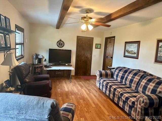 27414 S 4440th Rd, Vinita, OK 74301 - living room featuring beamed ceiling, light wood-style floors, and a ceiling fan