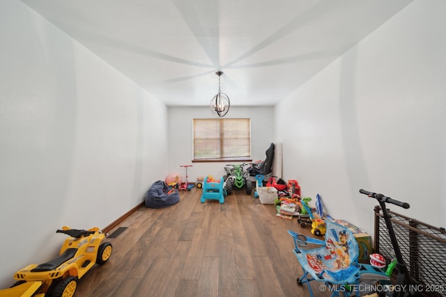 215 Rodman Cir, Muskogee, OK 74403 - recreation room with wood finished floors and baseboards