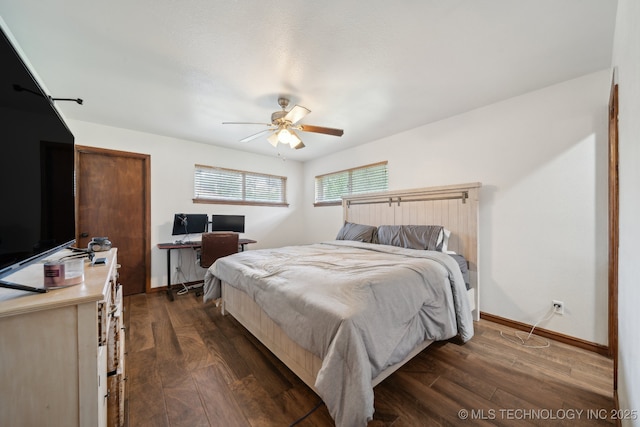215 Rodman Cir, Muskogee, OK 74403 - bedroom with dark wood finished floors, baseboards, and a ceiling fan