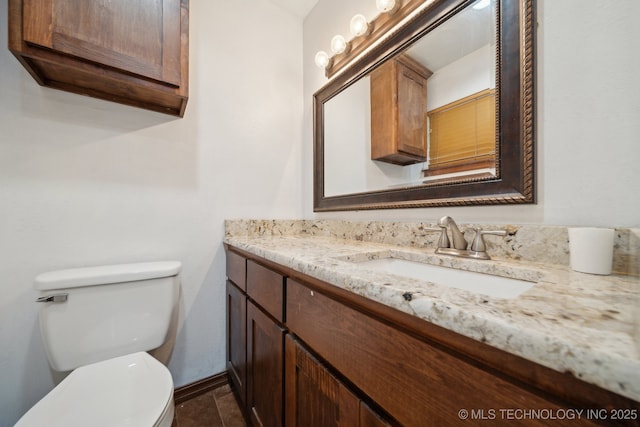 215 Rodman Cir, Muskogee, OK 74403 - half bathroom featuring toilet, vanity, and baseboards
