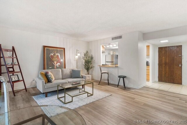 410 W 7th St Unit 1722, Tulsa, OK 74119 - living area with wood finished floors and baseboards