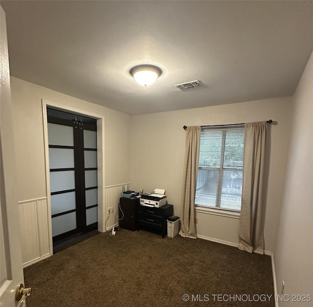 205 Ury, Caddo, OK 74729 - office with dark colored carpet and baseboards