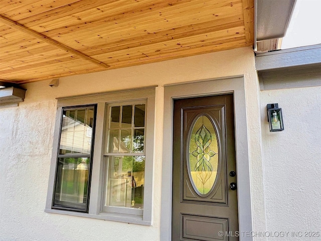 525 W Downing St, Tahlequah, OK 74464 - property entrance featuring stucco siding