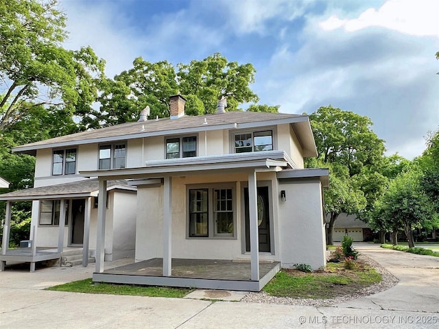 525 W Downing St, Tahlequah, OK 74464 - view of front of home featuring a porch, stucco siding, a chimney, and a shingled roof