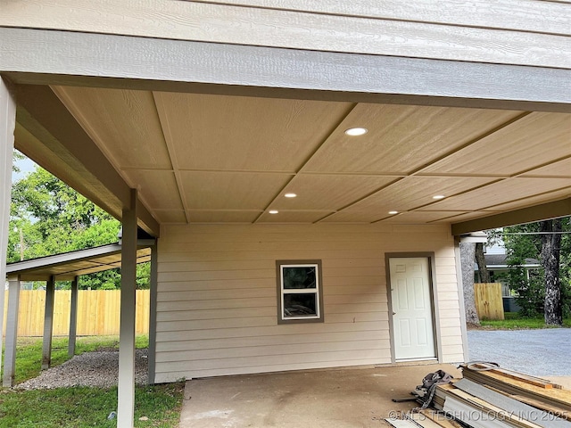 525 W Downing St, Tahlequah, OK 74464 - view of patio featuring fence and an attached carport