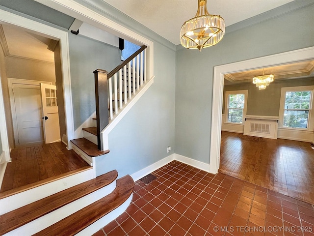 525 W Downing St, Tahlequah, OK 74464 - stairs featuring a chandelier, crown molding, baseboards, and wood finished floors