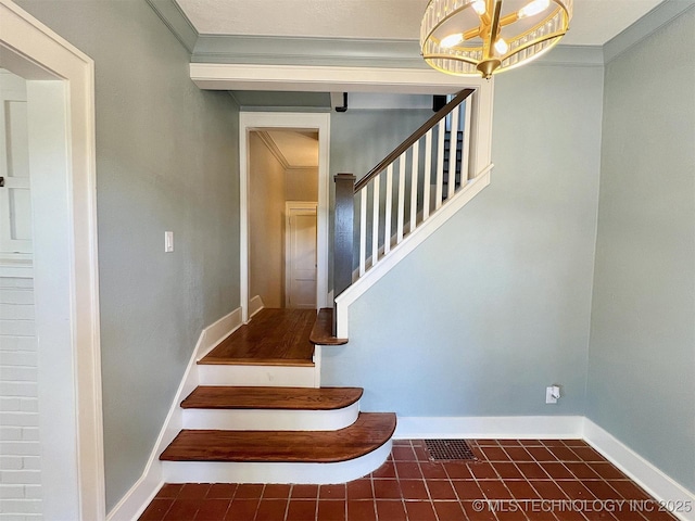 525 W Downing St, Tahlequah, OK 74464 - stairway with a chandelier, baseboards, tile patterned floors, and ornamental molding