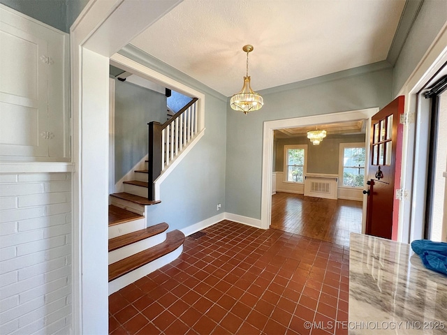525 W Downing St, Tahlequah, OK 74464 - stairs with a chandelier and baseboards