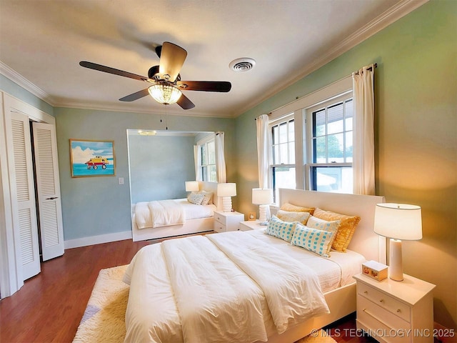 525 W Downing St, Tahlequah, OK 74464 - bedroom with wood finished floors, ornamental molding, baseboards, a closet, and a ceiling fan
