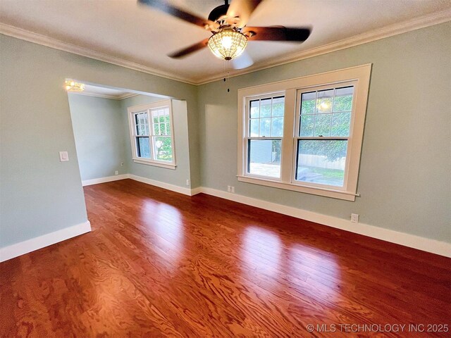 525 W Downing St, Tahlequah, OK 74464 - spare room with crown molding, a ceiling fan, wood finished floors, and baseboards