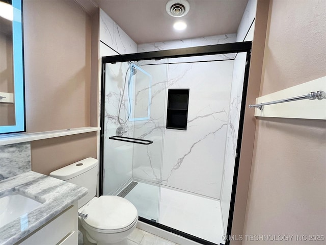 525 W Downing St, Tahlequah, OK 74464 - full bath with a marble finish shower, toilet, and vanity