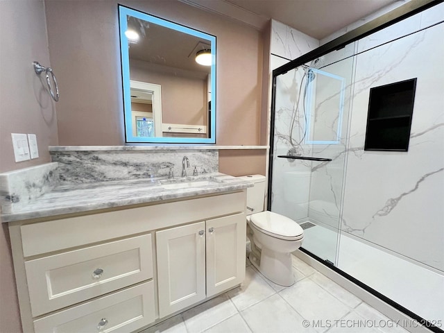 525 W Downing St, Tahlequah, OK 74464 - bathroom with a marble finish shower, toilet, vanity, and tile patterned floors