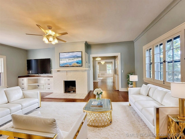 525 W Downing St, Tahlequah, OK 74464 - living area with ornamental molding, plenty of natural light, wood finished floors, a ceiling fan, and baseboards