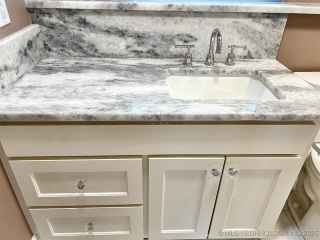 525 W Downing St, Tahlequah, OK 74464 - bathroom view of vanity and toilet