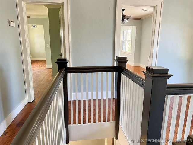 525 W Downing St, Tahlequah, OK 74464 - staircase with ornamental molding, a ceiling fan, wood finished floors, and baseboards
