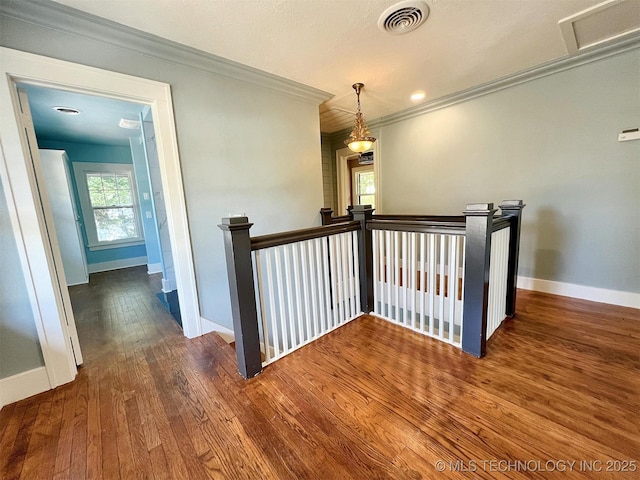 525 W Downing St, Tahlequah, OK 74464 - hallway featuring an upstairs landing, wood finished floors, baseboards, and ornamental molding