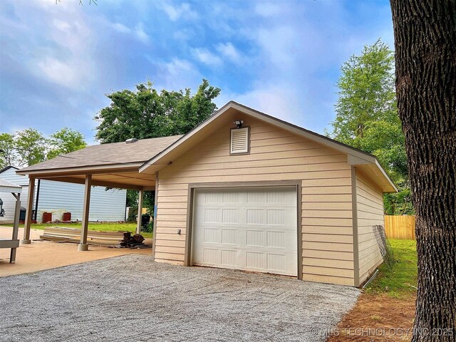 525 W Downing St, Tahlequah, OK 74464 - garage with a detached garage, driveway, and fence